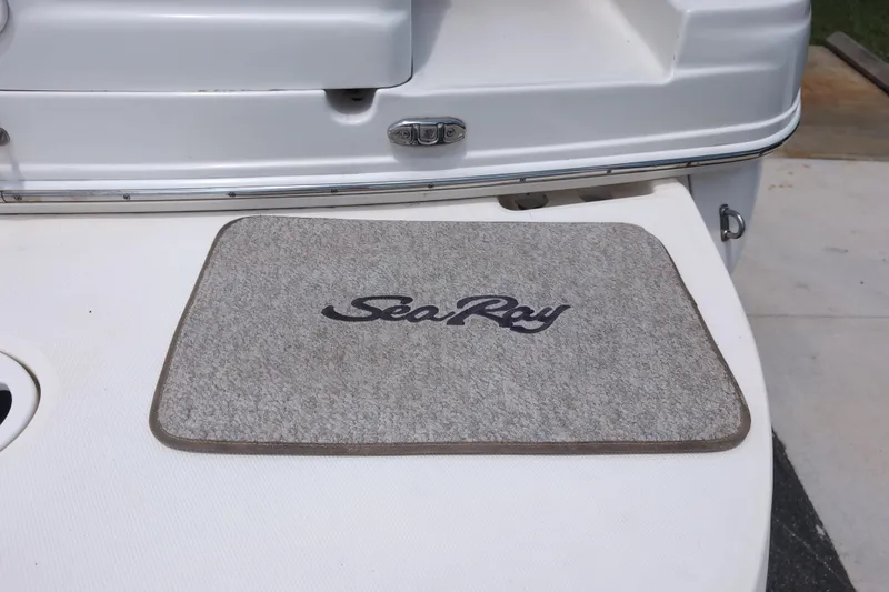 Slide: The Image of Gray mat with "Sea Ray" logo on a 2005 Sundancer 280 boat deck. - 10