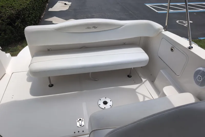 Slide: The Image of 2005 Sea Ray Sundancer 280 boat interior with white seating and deck area. - 18