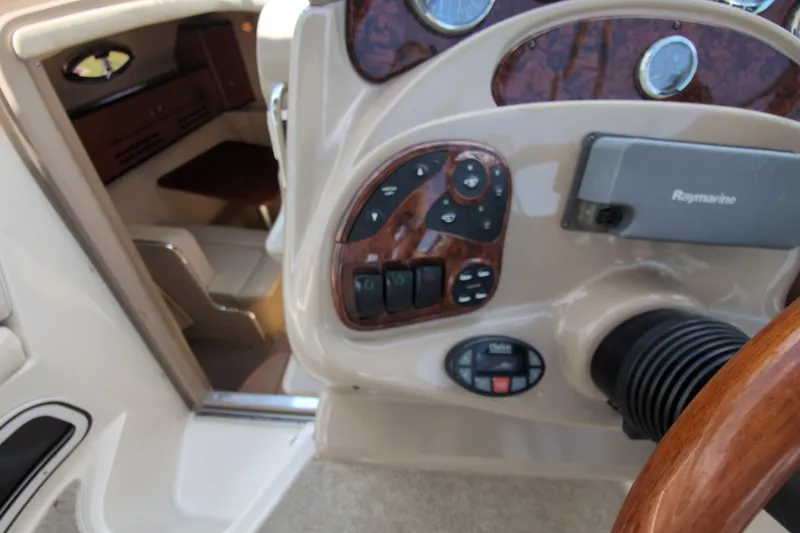 Slide: The Image of 2005 Sea Ray Sundancer 280 helm with Raymarine navigation and cabin view. - 29