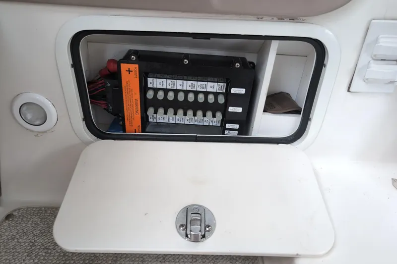 Slide: The Image of Electrical panel inside a 2005 Sea Ray Sundancer 280 boat compartment. - 32