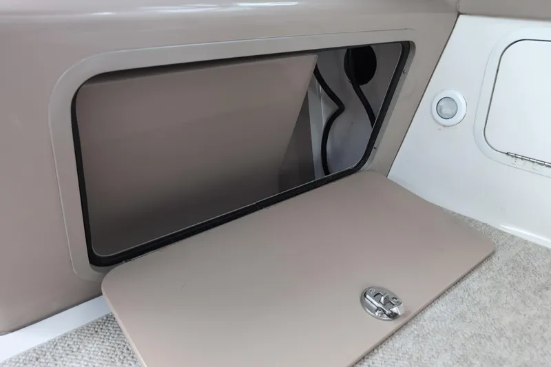 Slide: The Image of Storage compartment on a 2005 Sea Ray Sundancer 280 boat interior. - 34
