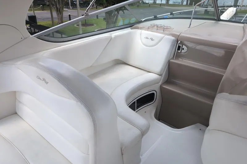Slide: The Image of 2005 Sea Ray Sundancer 280 interior with white seating and sleek design. - 35