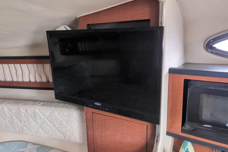 Slide: The Image of Interior of 2005 Sea Ray Sundancer 280 with TV and microwave in cabin. - 37