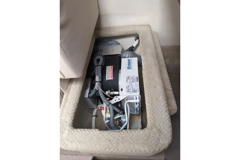 Slide: The Image of 2005 Sea Ray Sundancer 280 interior showing HVAC system under carpeted panel. - 49