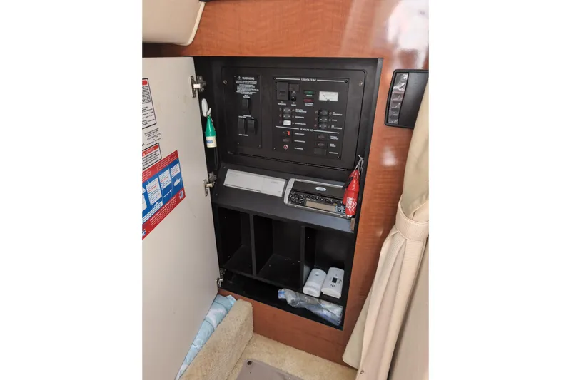 Slide: The Image of Electrical panel inside 2005 Sea Ray Sundancer 280 boat cabin. - 52