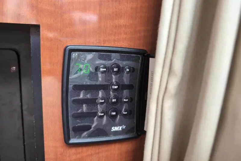 Slide: The Image of Thermostat control panel on 2005 Sea Ray Sundancer 280 boat interior. - 54