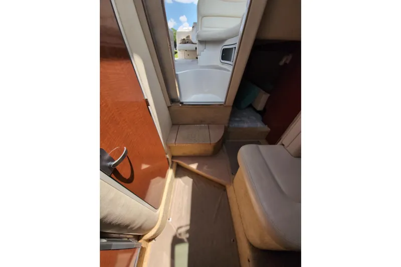Slide: The Image of Interior view of 2005 Sea Ray Sundancer 280 cabin with seating and steps. - 55