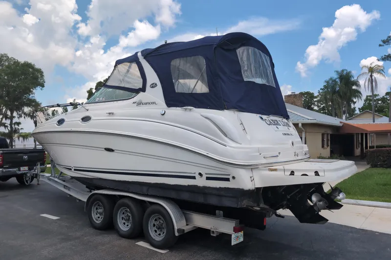 Slide: The Image of 2005 Sea Ray Sundancer 280 boat on trailer, parked in residential area. - 6