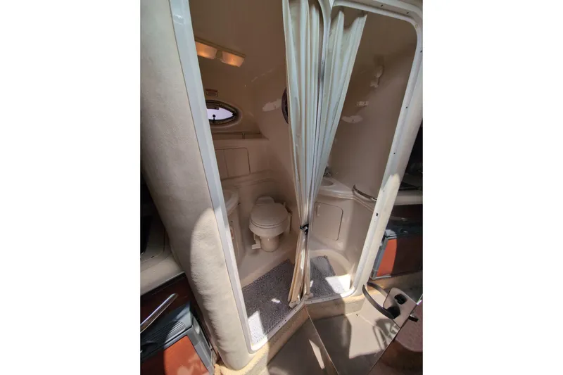 Slide: The Image of 2005 Sea Ray Sundancer 280 bathroom interior with toilet and shower curtain. - 61