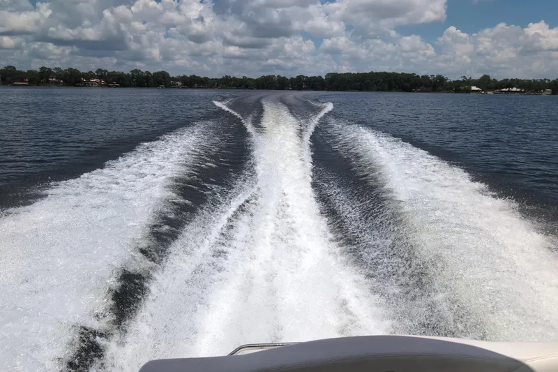 Slide: The Image of Wake trail behind a 2005 Sea Ray Sundancer 280 on a sunny lake. - 63