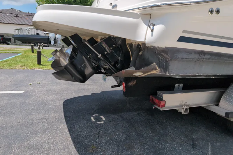 Slide: The Image of 2005 Sea Ray Sundancer 280 boat on trailer, showing stern and propellers. - 75