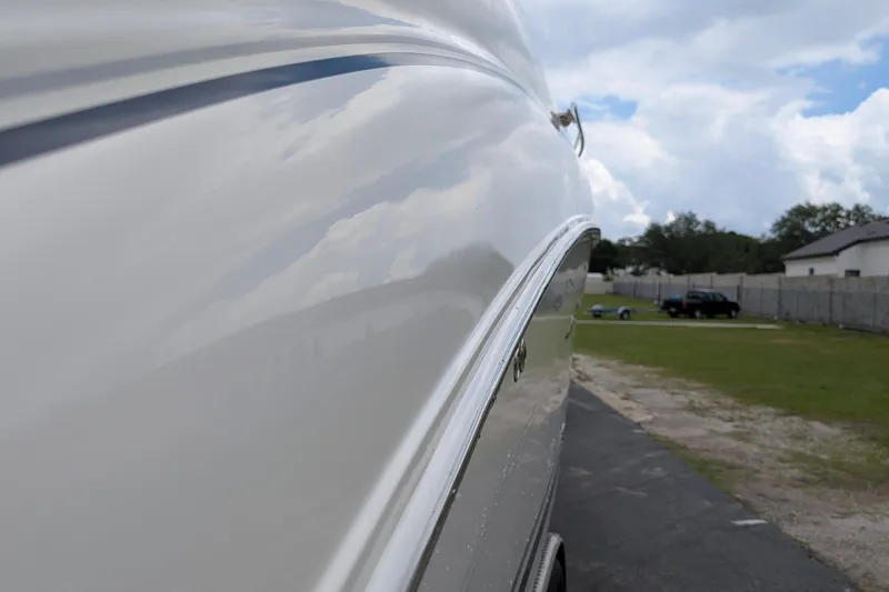 Slide: The Image of Side view of a 2005 Sea Ray Sundancer 280 boat, showcasing sleek design. - 86