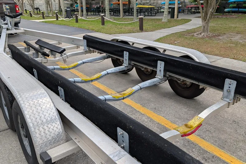 Slide: The Image of Boat trailer for 2005 Sea Ray Sundancer 280, parked on a paved area. - 88