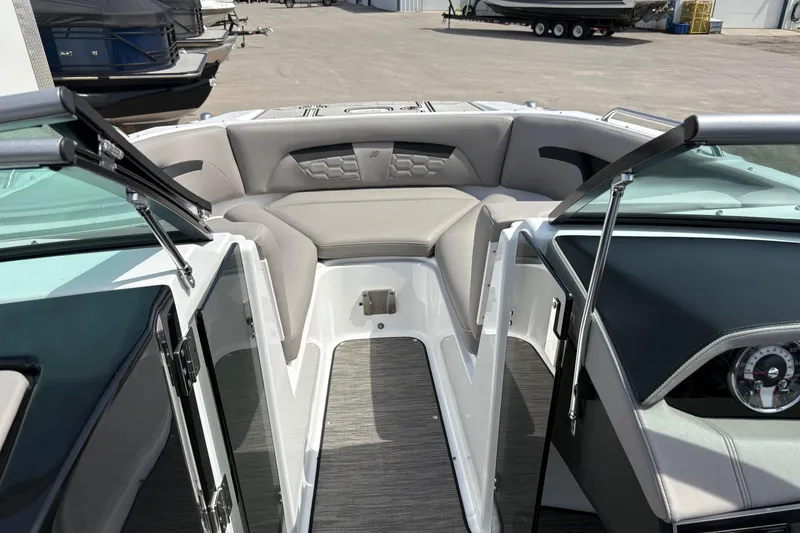 Slide: The Image of 2023 Four Winns HD3 boat interior with sleek seating and modern dashboard design. - 12