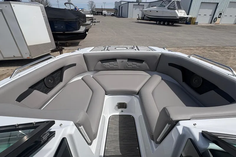 Slide: The Image of 2023 Four Winns HD3 boat interior with gray seating and modern design. - 13