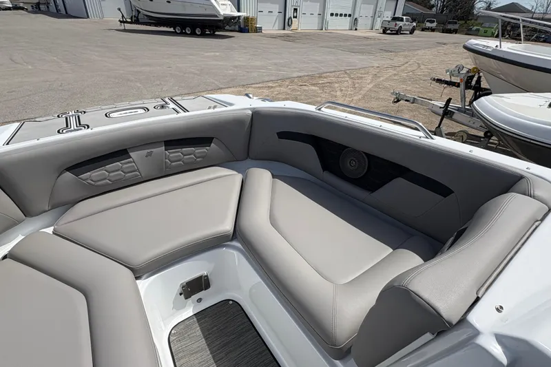 Slide: The Image of 2023 Four Winns HD3 boat interior with gray seating and speaker system. - 14