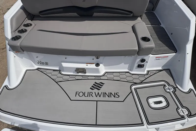 Slide: The Image of 2023 Four Winns HD3 boat deck with seating and cup holders. - 5