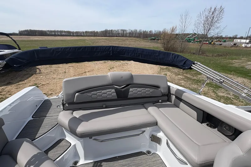 Slide: The Image of 2023 Four Winns HD3 boat interior with gray seating and open landscape view. - 6