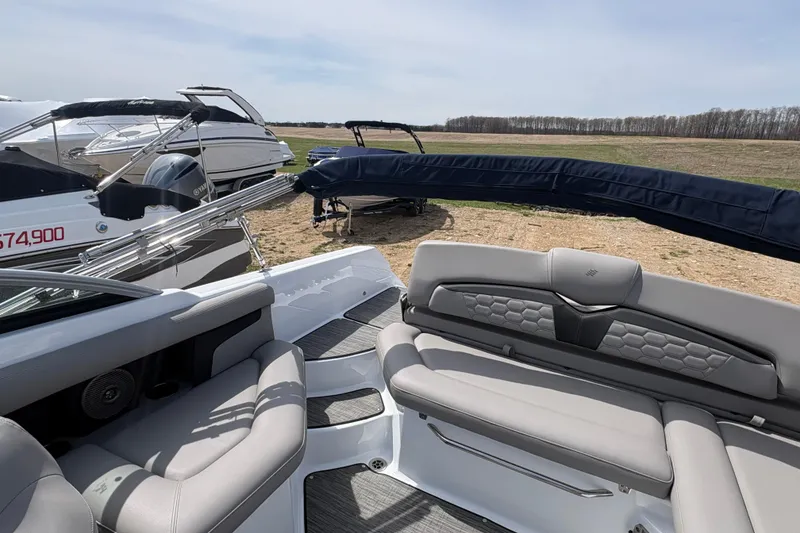 Slide: The Image of 2023 Four Winns HD3 boat interior with plush seating and sleek design. - 8