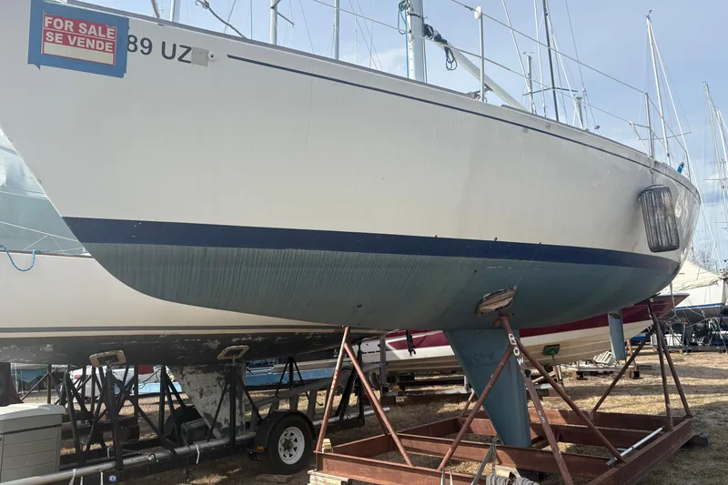 Slide: The Image of 1976 J Boats J/29 sailboat on stands, for sale, with visible keel and hull. - 4