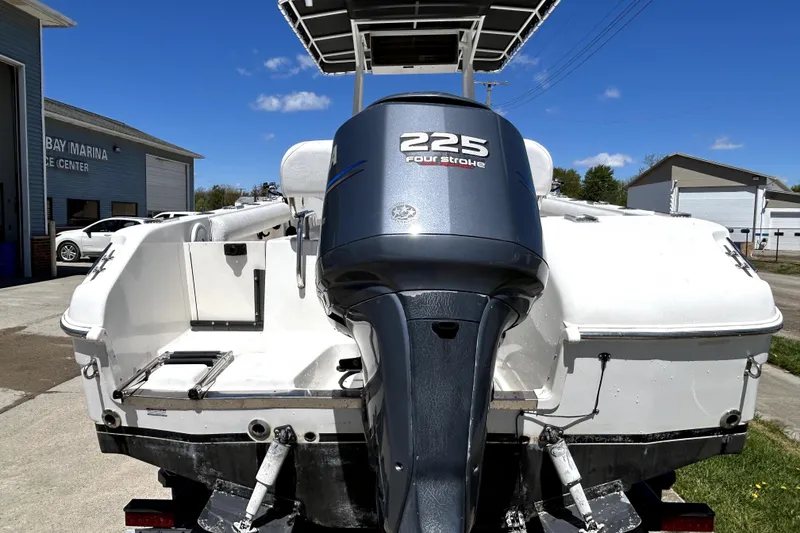 Slide: The Image of 2004 Robalo R230 Center Console boat with 225 four-stroke engine at marina. - 5