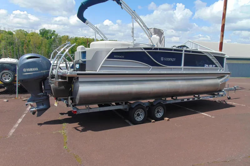 The Image of 2020 Godfrey Monaco 235 SB pontoon boat on trailer with Yamaha outboard motor. - 1
