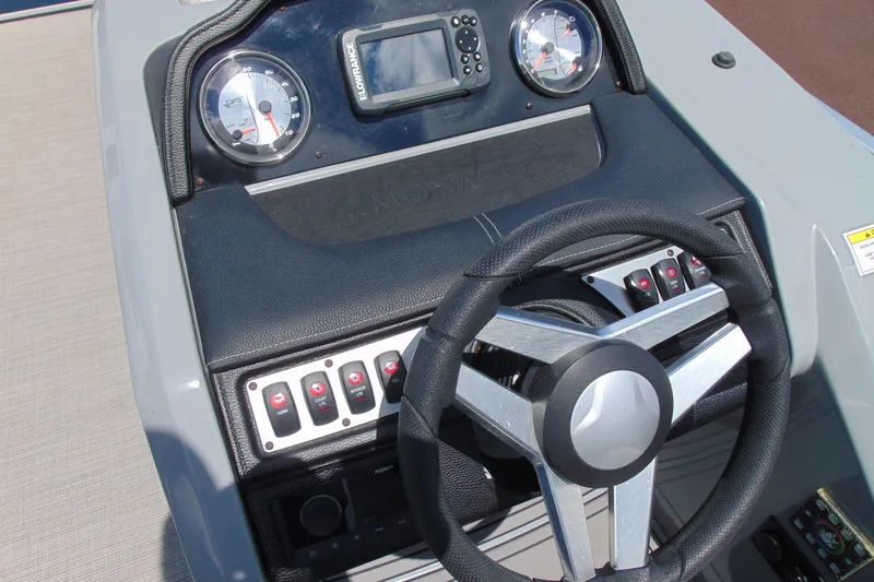 Slide: The Image of Dashboard of 2020 Godfrey Monaco 235 SB boat with steering wheel and controls. - 10