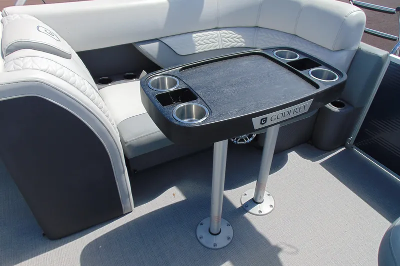 Slide: The Image of Interior of 2020 Godfrey Monaco 235 SB boat with seating and table. - 13