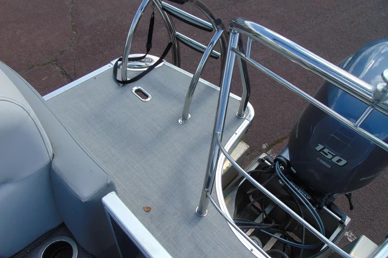 Slide: The Image of 2020 Godfrey Monaco 235 SB boat with Yamaha 150 engine and sleek metal railings. - 16