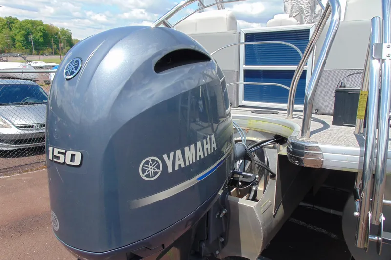 Slide: The Image of 2020 Godfrey Monaco 235 SB with Yamaha 150 outboard motor, docked outdoors. - 3