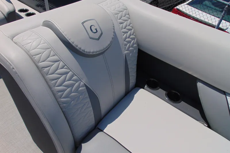 Slide: The Image of Luxurious seating on a 2020 Godfrey Monaco 235 SB boat with elegant stitching and cup holders. - 5