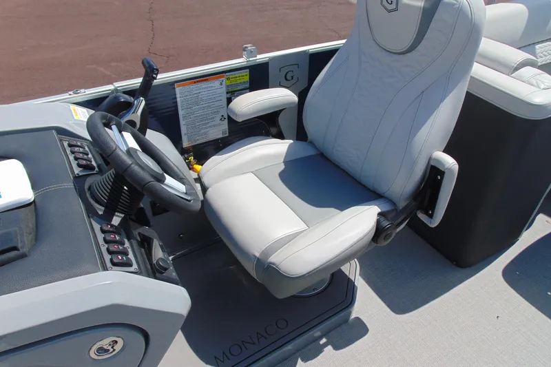 Slide: The Image of Captain's chair and helm of 2020 Godfrey Monaco 235 SB pontoon boat. - 9