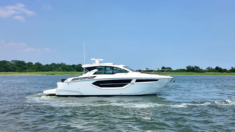 Slide: The Image of 2024 Cruisers Yachts 42 Cantius on calm water, side view. - 1