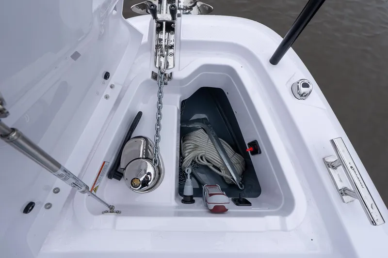 Slide: The Image of Anchor compartment of 2025 Axopar Cross Top boat with chain and rope. - 11