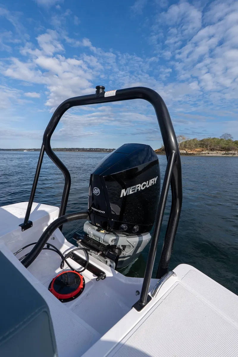 Slide: The Image of 2025 Axopar Cross Top boat with Mercury engine on a calm lake. - 28