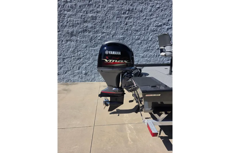 Slide: The Image of 2022 G3 Sportsman 1710 boat with Yamaha VMAX outboard motor, parked on concrete. - 10