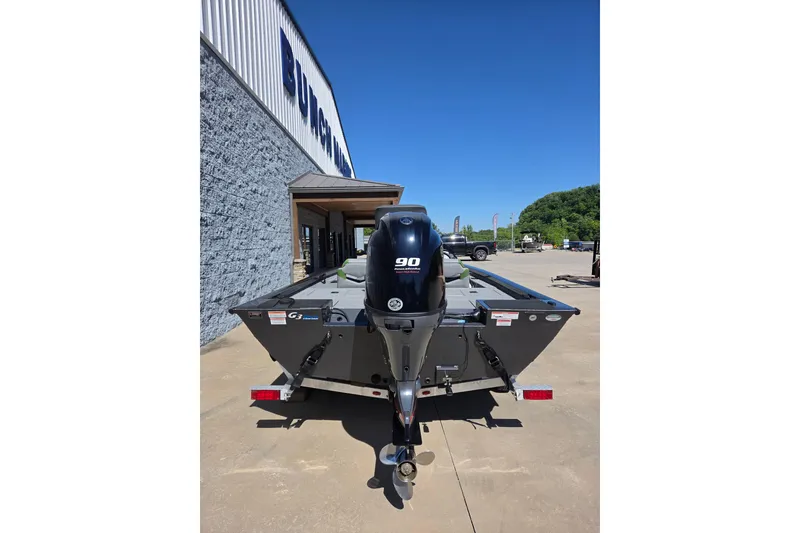 Slide: The Image of 2022 G3 Sportsman 1710 boat with 90 HP engine, parked outside dealership. - 11