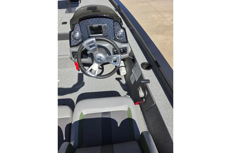 Slide: The Image of 2022 G3 Sportsman 1710 boat cockpit with steering wheel and control panel. - 13