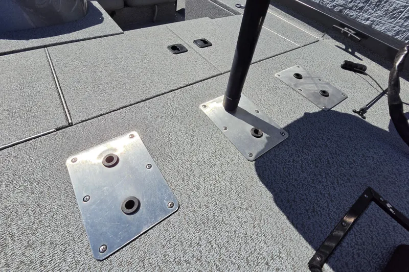 Slide: The Image of 2022 G3 Sportsman 1710 boat deck with seat mounts and textured flooring. - 17