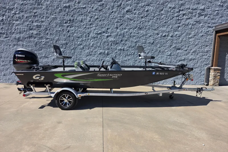 The Image of 2022 G3 Sportsman 1710 fishing boat on trailer, parked outdoors. - 8