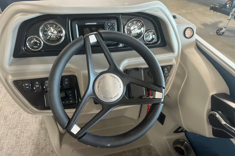 Slide: The Image of Steering console of 2025 Trifecta 20RFLE2.75 boat with gauges and controls. - 8