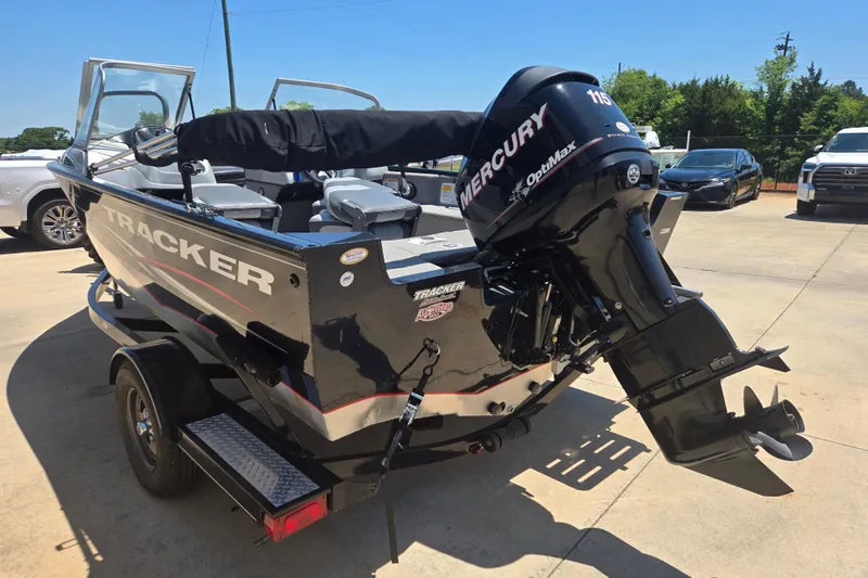 Slide: The Image of 2013 Tracker Pro Guide V-175 Combo boat with Mercury OptiMax engine on trailer. - 12
