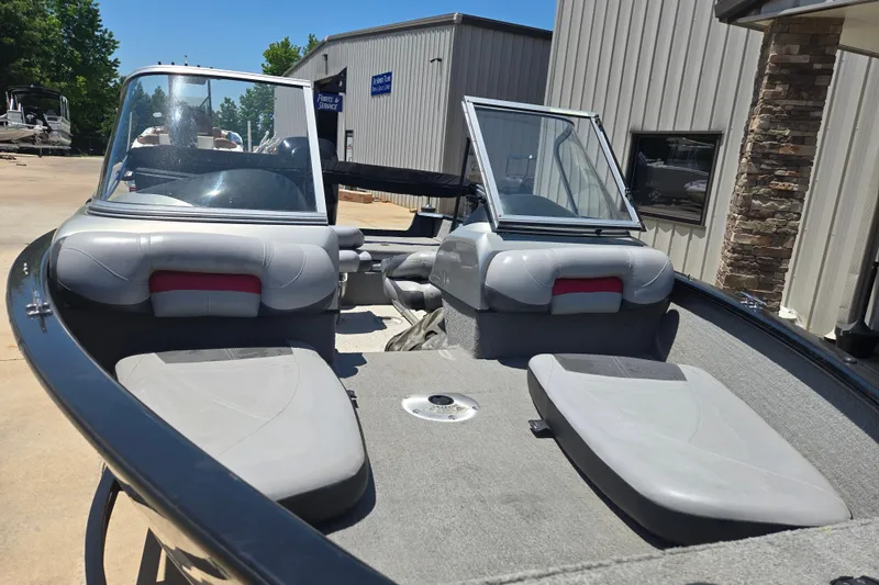 Slide: The Image of 2013 Tracker Pro Guide V-175 Combo boat interior with open windshield and seating. - 6