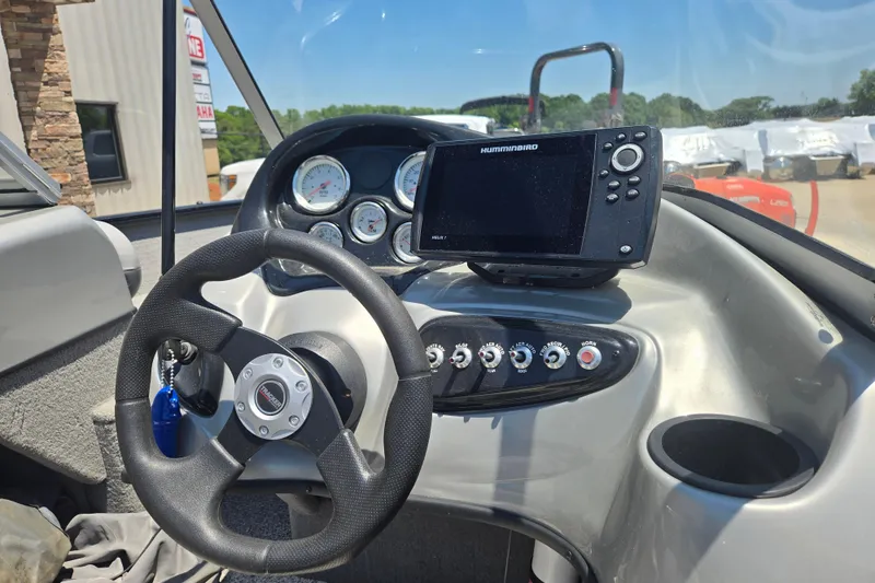 Slide: The Image of 2013 Tracker Pro Guide V-175 Combo dashboard with steering wheel and Humminbird fish finder. - 8