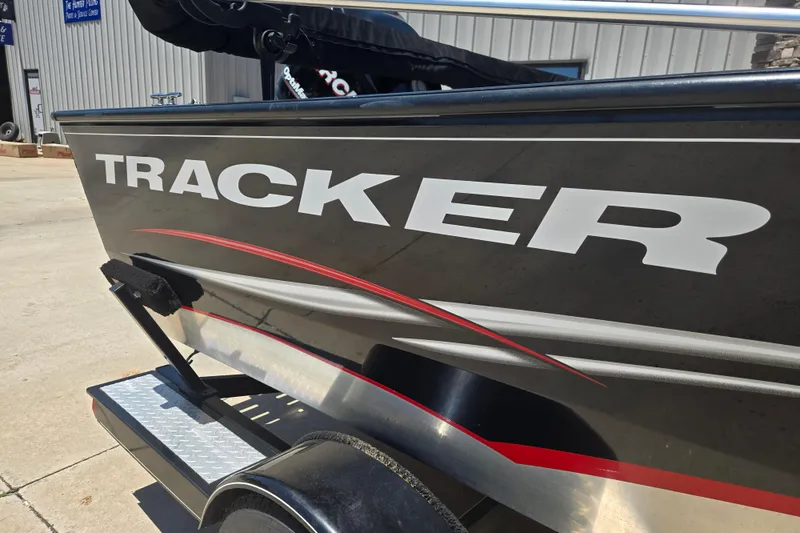 Slide: The Image of 2013 Tracker Pro Guide V-175 Combo boat on trailer, featuring bold branding. - 9