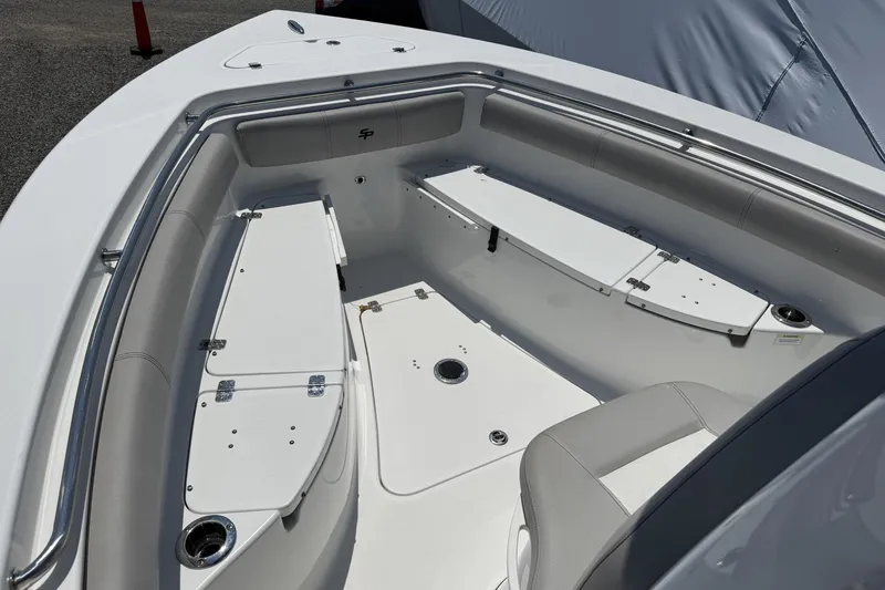 Slide: The Image of 2019 Sea Pro 239 Center Console boat interior with seating and storage compartments. - 10