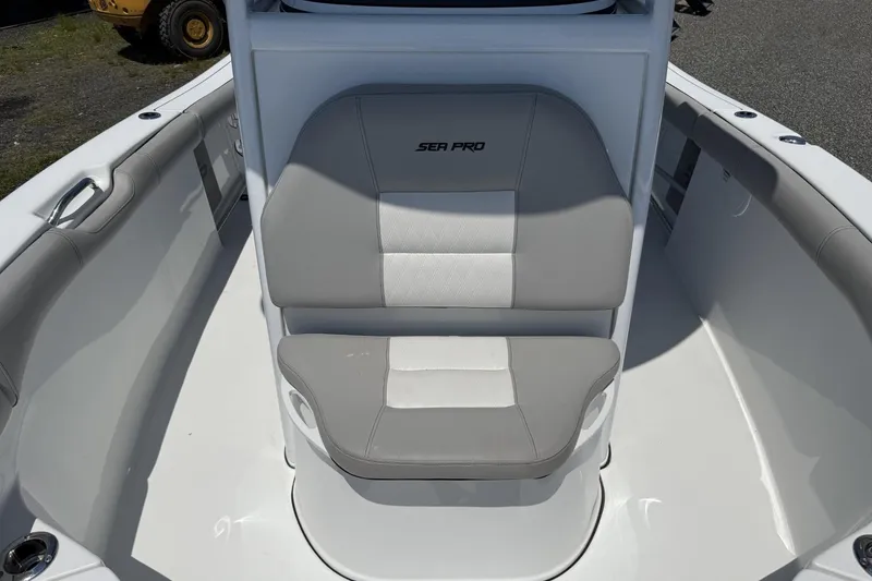 Slide: The Image of 2019 Sea Pro 239 Center Console boat with gray and white seating. - 11