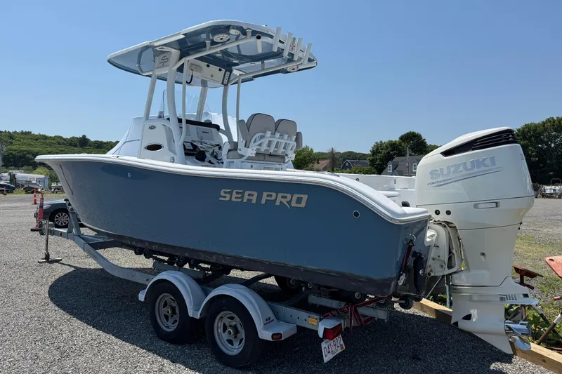 The Image of 2019 Sea Pro 239 Center Console boat with Suzuki outboard engine on trailer. - 0
