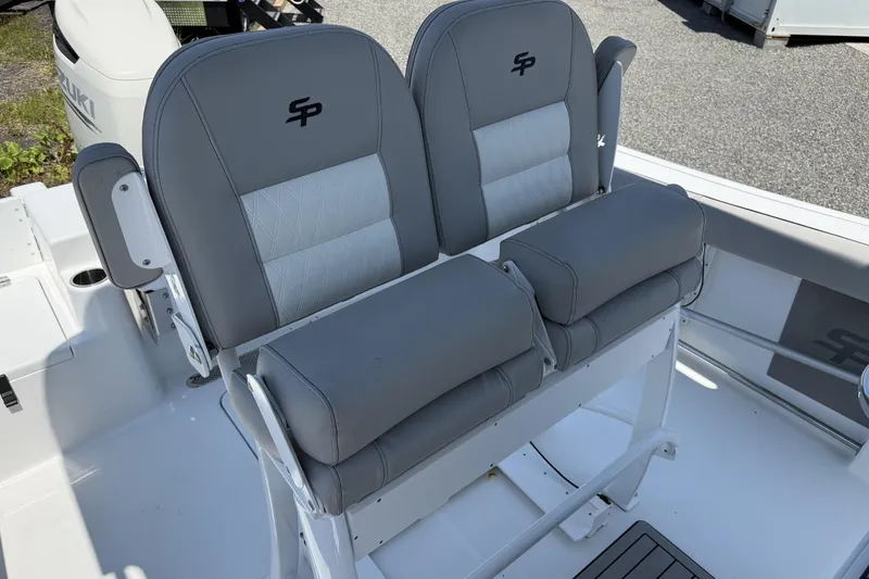 Slide: The Image of 2019 Sea Pro 239 Center Console boat with dual gray cushioned seats. - 8