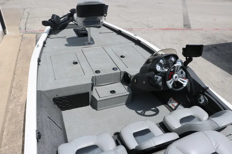 Slide: The Image of 2018 Tracker Pro Team 195 TXW boat interior with steering console and seating. - 12
